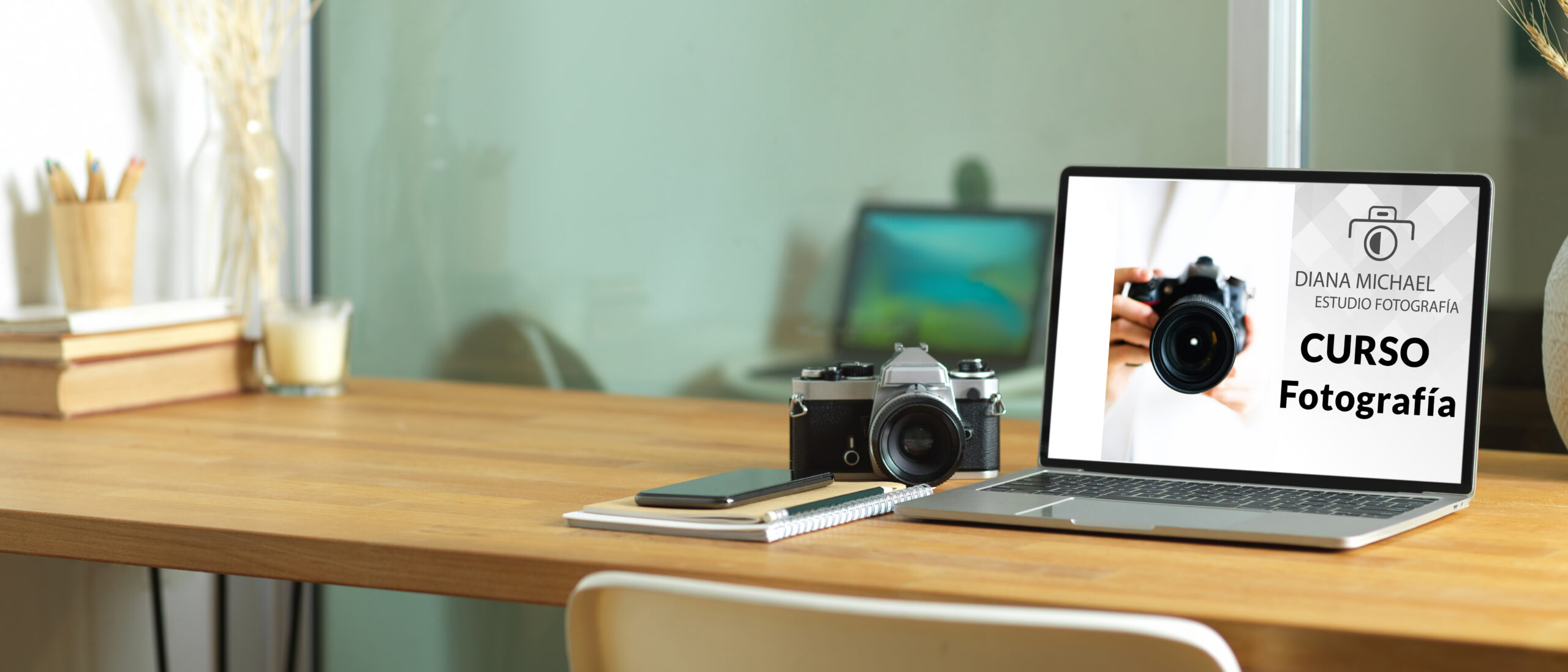 Close up view of worktable with laptop, camera, stationery and copy space on the table, clipping path